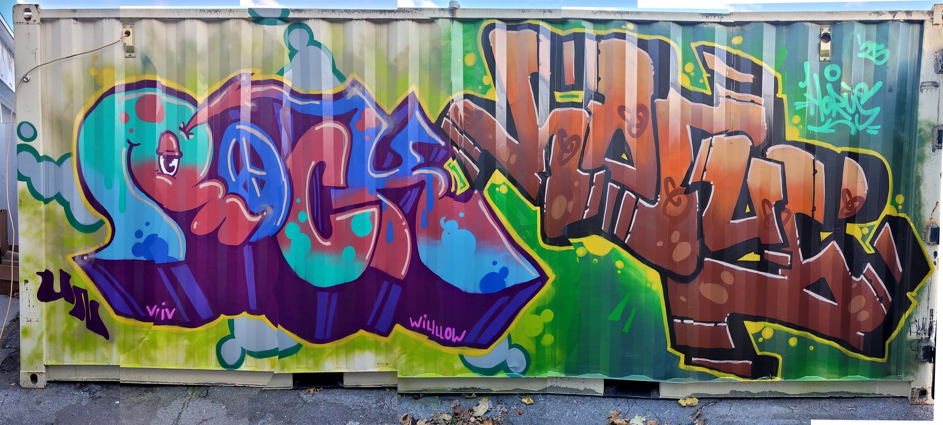  Full view of the shipping container graffiti. The container displays classic graffiti art, serving as an exterior for a gallery of graffiti collectibles.